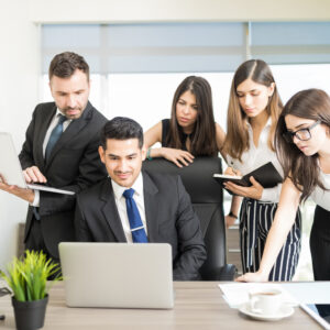 powerful office workers watching presentation laptop desk office